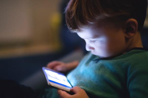 A toddler on an smartphone.