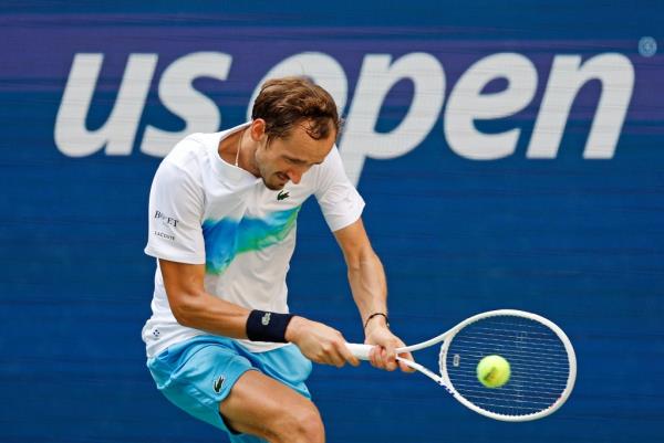 aniil Medvedev [5] returns a volley against Nuno Borges (POR) during their match on Arthur Ashe Stadium at the 2024 US Open Championship.